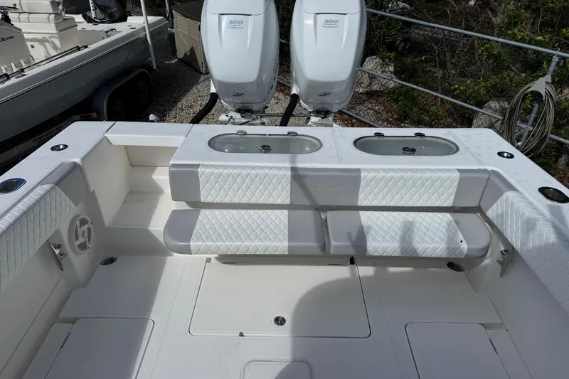 Slide: The Image of 2014 Blackwater 36 Sportfish boat interior with twin engines and cushioned seating. - 10