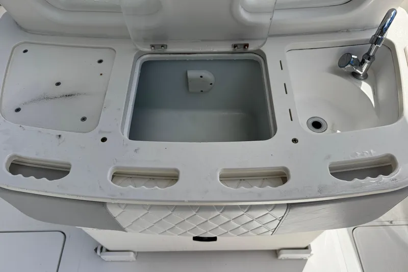 Slide: The Image of Fishing station on 2014 Blackwater 36 Sportfish with sink and storage compartments. - 16
