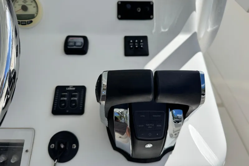 Slide: The Image of Control panel of a 2014 Blackwater 36 Sportfish boat with throttle and gauges. - 18