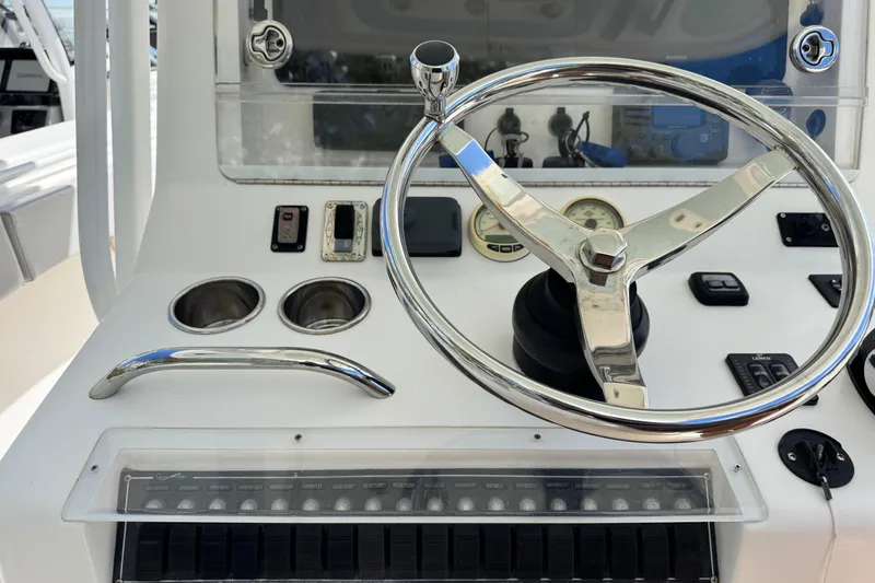 Slide: The Image of Steering console of a 2014 Blackwater 36 Sportfish boat with controls and gauges. - 19