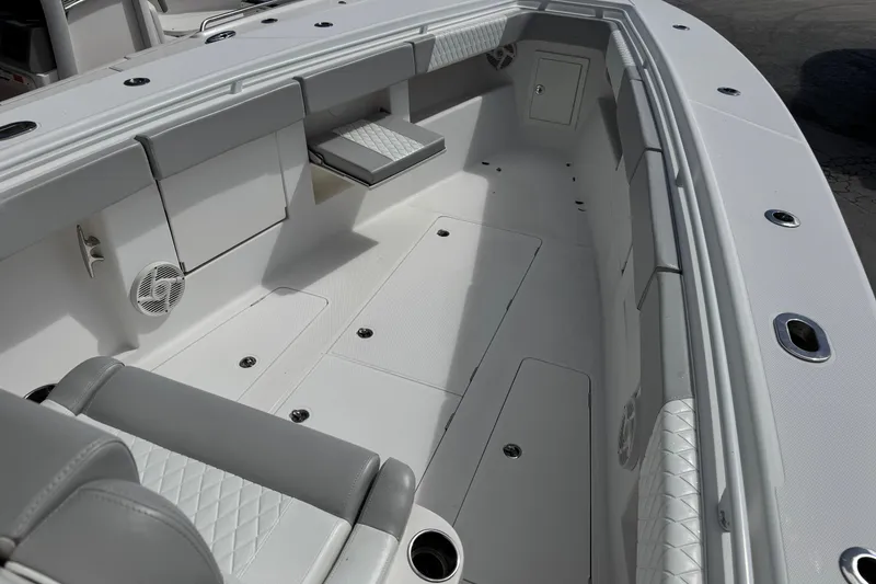 Slide: The Image of Spacious interior of 2014 Blackwater 36 Sportfish boat with cushioned seating and storage. - 26
