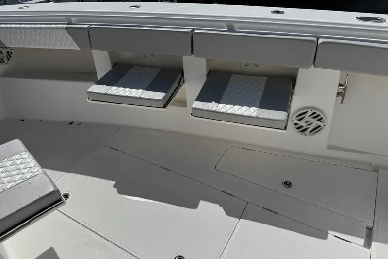 Slide: The Image of Interior seating of 2014 Blackwater 36 Sportfish boat with gray cushions. - 29