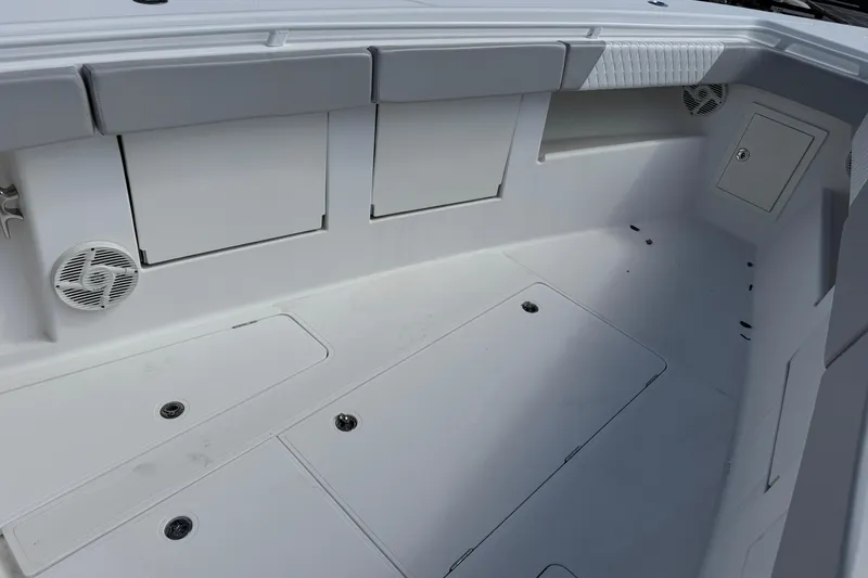Slide: The Image of Spacious deck of 2014 Blackwater 36 Sportfish boat with storage compartments. - 30
