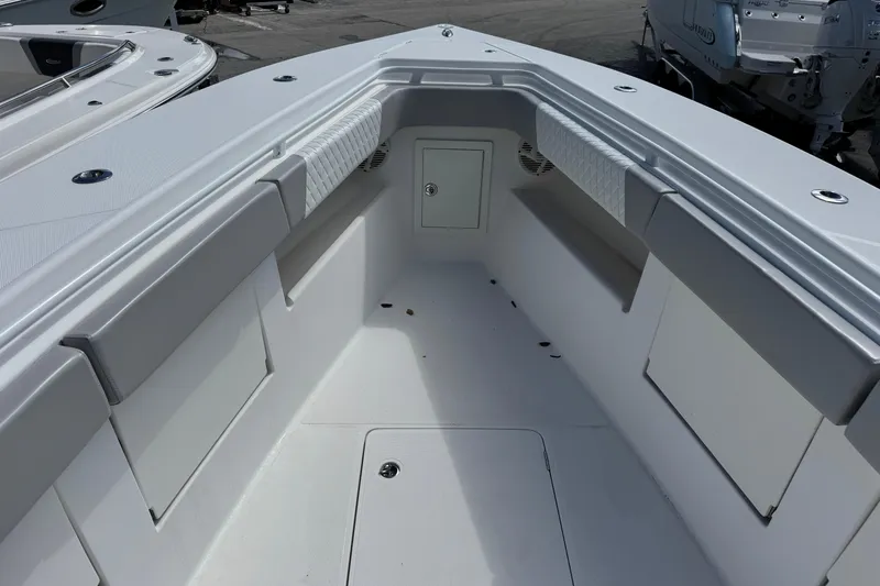 Slide: The Image of 2014 Blackwater 36 Sportfish boat interior with cushioned seating and storage compartments. - 32