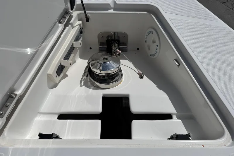 Slide: The Image of Anchor compartment of 2014 Blackwater 36 Sportfish boat, featuring a winch and washdown system. - 33
