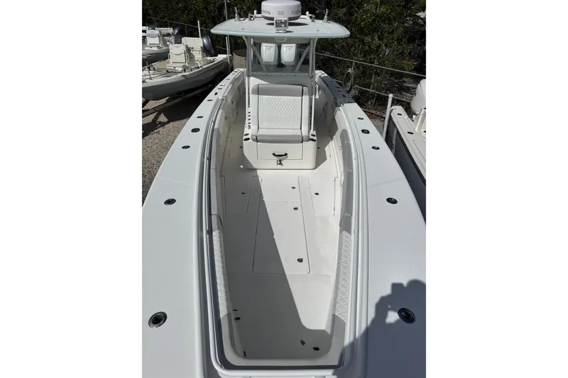 Slide: The Image of 2014 Blackwater 36 Sportfish boat with spacious deck and seating area. - 34