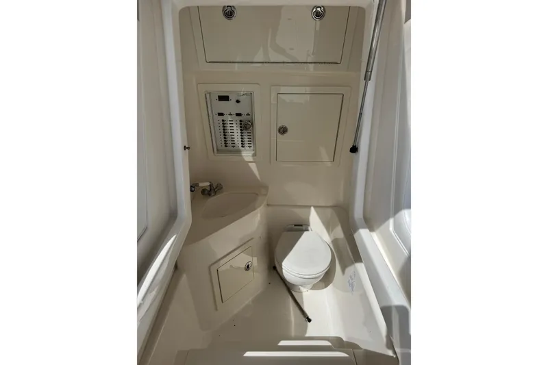 Slide: The Image of 2014 Blackwater 36 Sportfish boat interior bathroom with toilet and sink. - 37