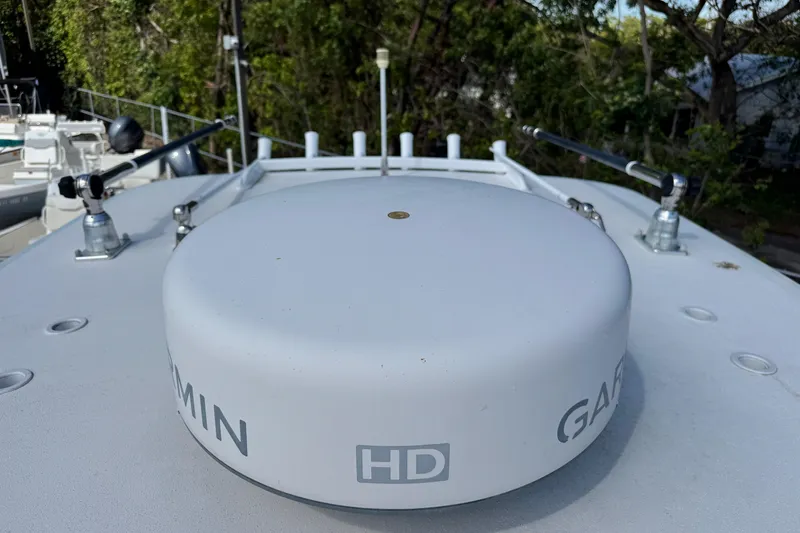 Slide: The Image of Garmin HD radar on 2014 Blackwater 36 Sportfish boat, surrounded by trees. - 39