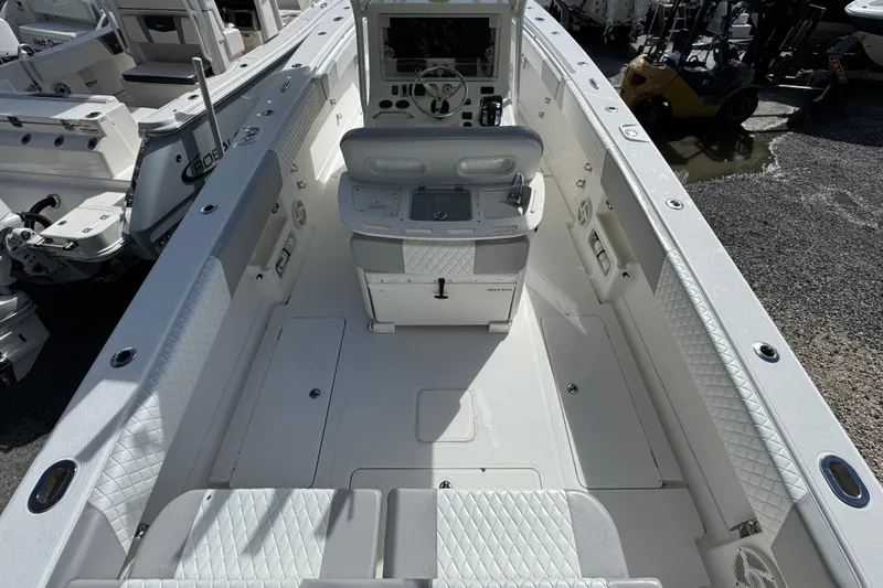 Slide: The Image of 2014 Blackwater 36 Sportfish boat interior with white seating and control panel. - 7