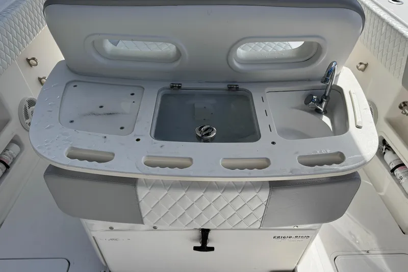 Slide: The Image of Fishing station on 2014 Blackwater 36 Sportfish with sink and storage compartments. - 8