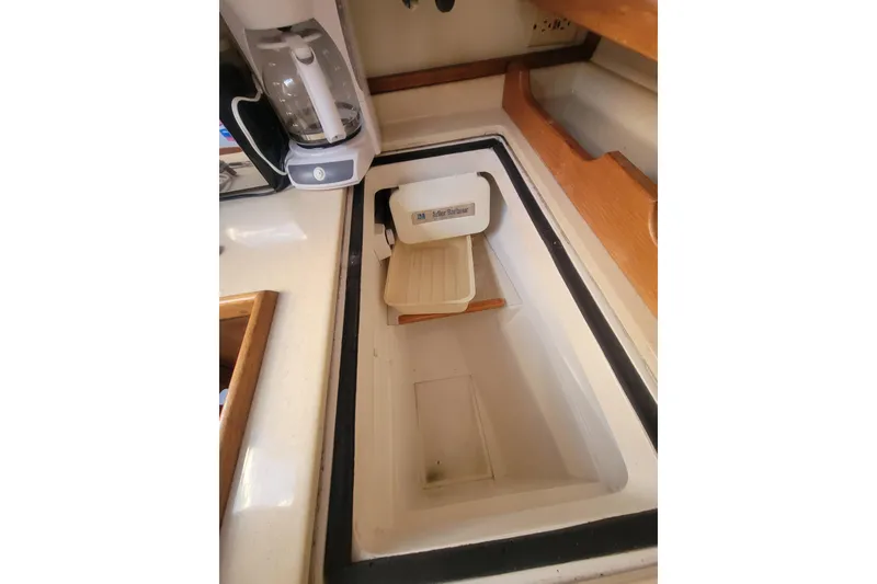 Slide: The Image of Interior of 1996 Catalina 36 MkII sailboat galley with built-in cooler and coffee maker. - 17