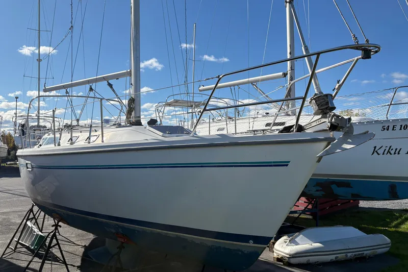 Slide: The Image of 1996 Catalina 36 MkII sailboat on stands, clear sky background. - 2