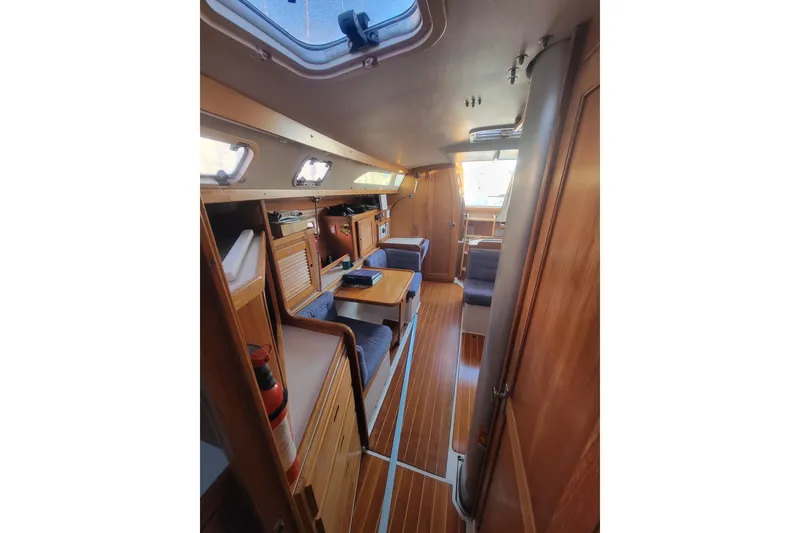 Slide: The Image of Interior of 1996 Catalina 36 MkII sailboat with wood finish and seating area. - 24
