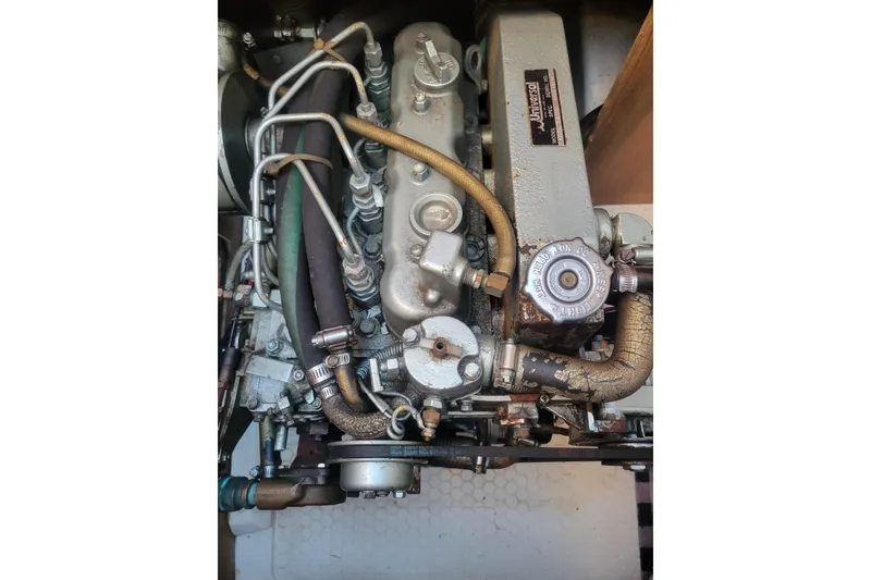 Slide: The Image of Catalina 36 MkII 1996 engine compartment with visible hoses and components. - 28