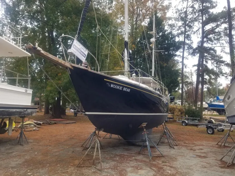 The Image of 1964 Columbia 33 sailboat Wookie Bear on stands in a boatyard. - 0