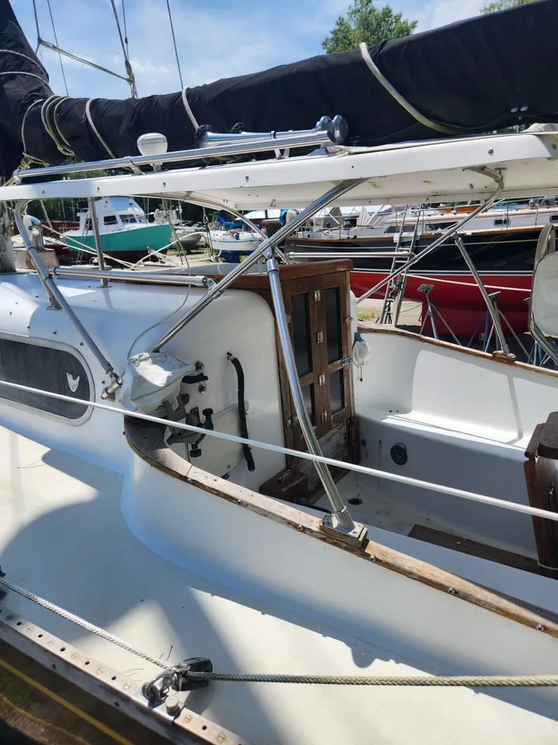 Slide: The Image of 1964 Columbia 33 sailboat docked at marina. - 11