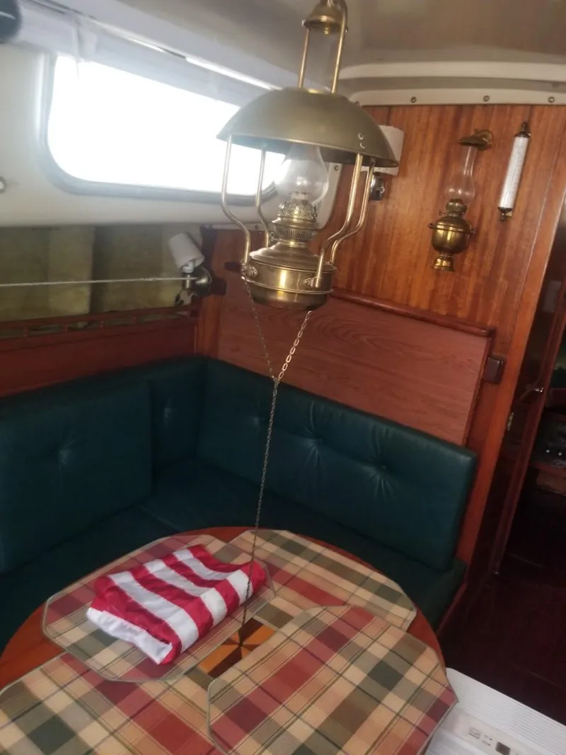 Slide: The Image of Interior of a 1964 Columbia 33 sailboat with vintage brass lantern. - 16