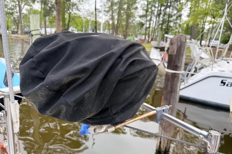 Slide: The Image of Covered outboard motor on a 1964 Columbia 33 boat. - 23