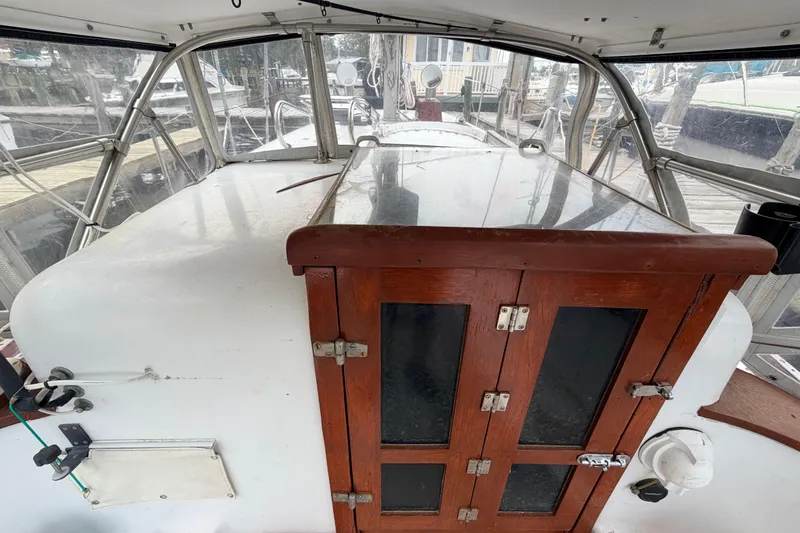 Slide: The Image of 1964 Columbia 33 sailboat cockpit with wooden hatch and clear canopy. - 25