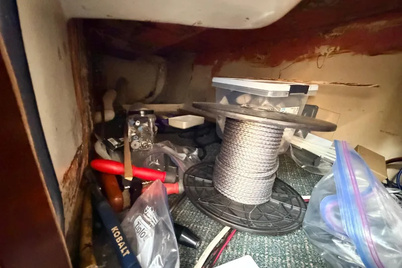 Slide: The Image of Tools and supplies stored in a Columbia 33 sailboat, model year 1964. - 40