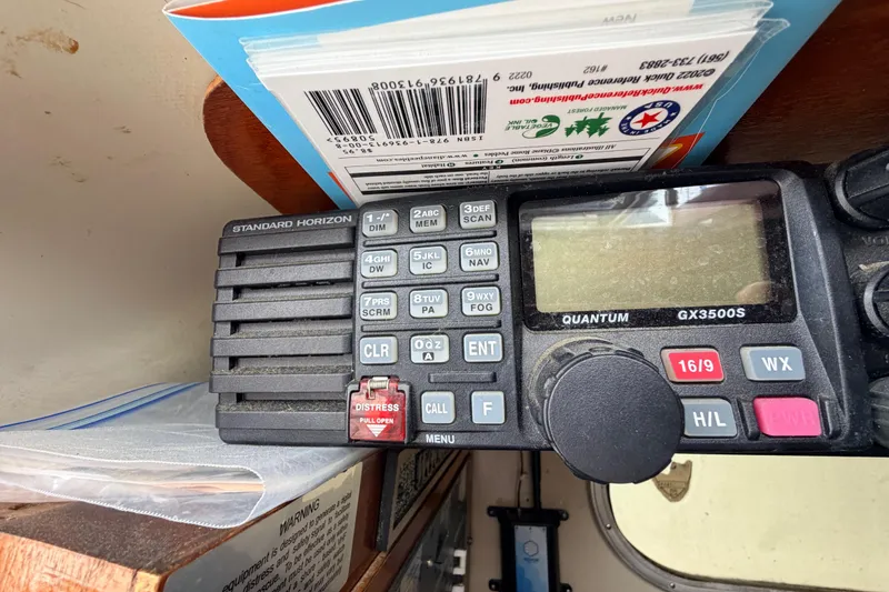 Slide: The Image of Marine radio equipment on a 1964 Columbia 33 sailboat, featuring Standard Horizon Quantum GX3500S. - 42