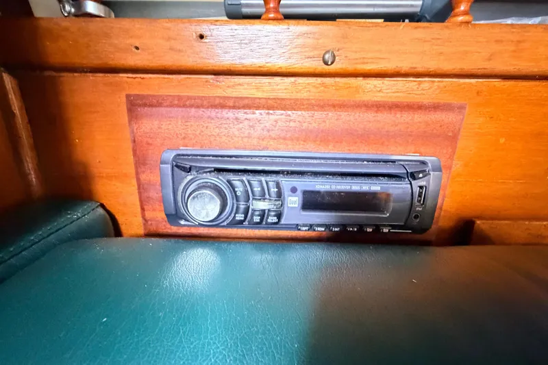 Slide: The Image of Built-in stereo system on a 1964 Columbia 33 sailboat with wooden interior. - 43