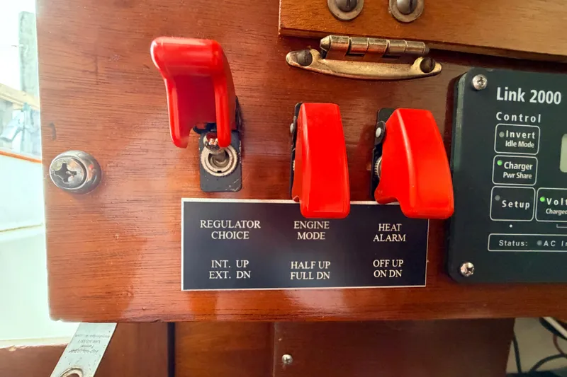 Slide: The Image of Control panel with red switches on a 1964 Columbia 33 boat. - 45