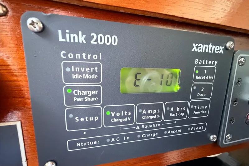 Slide: The Image of Xantrex Link 2000 control panel on a 1964 Columbia 33 boat, displaying battery status. - 47