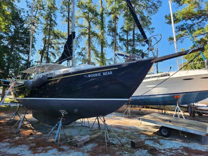 Slide: The Image of 1964 Columbia 33 sailboat Wookie Bear on stands in a boatyard. - 5
