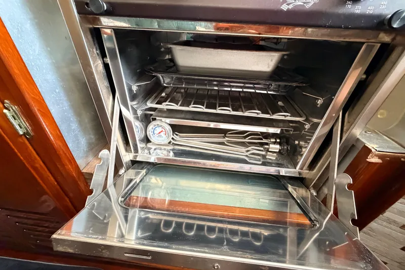 Slide: The Image of Vintage Columbia 33 oven interior from 1964, featuring racks and a thermometer. - 55