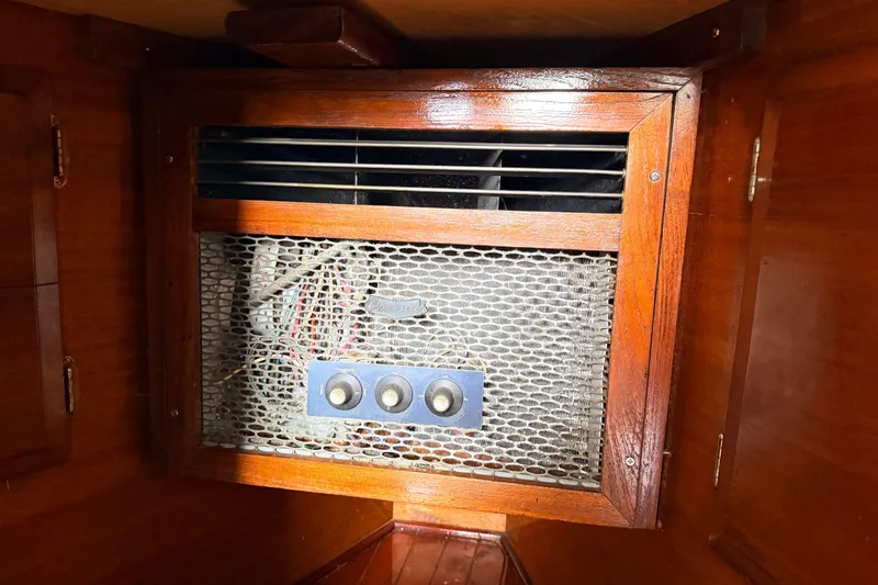 Slide: The Image of Vintage Columbia 33 boat interior with wooden paneling and ventilation system, 1964 model. - 58