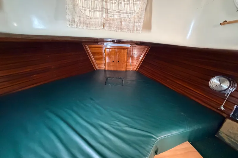 Slide: The Image of Interior of a 1964 Columbia 33 yacht with wooden walls. - 60