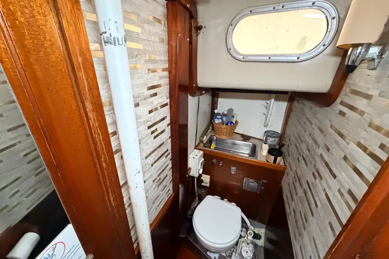 Slide: The Image of Compact bathroom in a 1964 Columbia 33 yacht. - 63