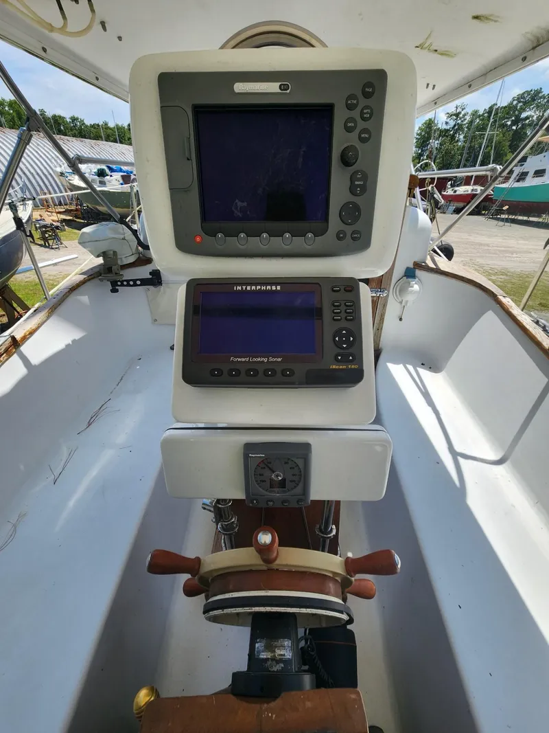Slide: The Image of Cockpit of a 1964 Columbia 33 sailboat with navigation equipment. - 9