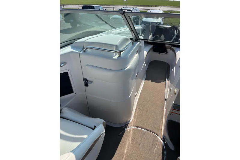 Slide: The Image of Interior view of 2008 Four Winns H260 RS boat, featuring seating and walkway. - 10