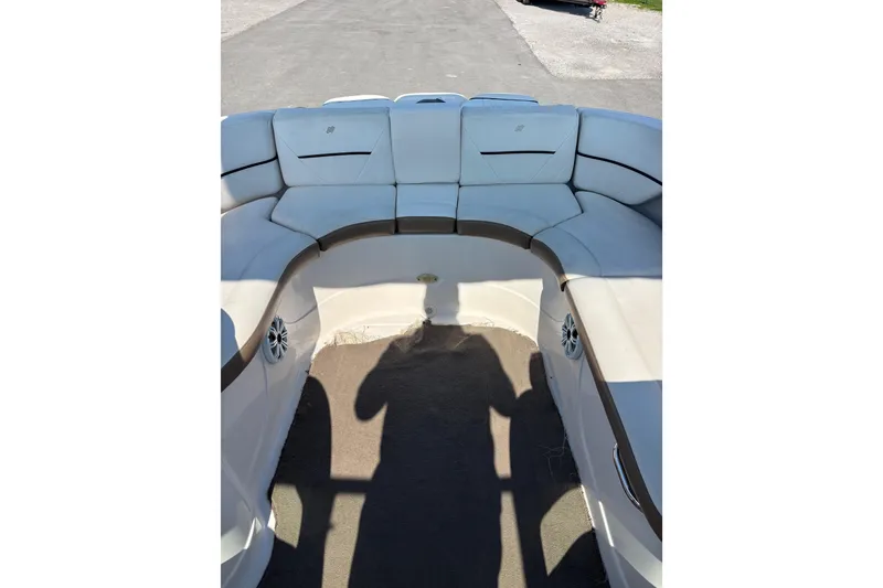 Slide: The Image of 2008 Four Winns H260 RS boat interior with white seating and speaker system. - 11