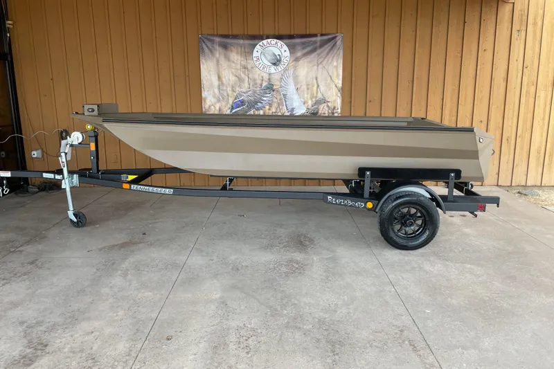 The Image of 2026 Reaper 653 Timber Reaper boat on trailer, displayed outdoors. - 0