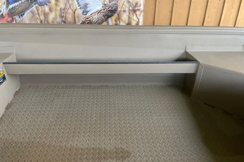 Slide: The Image of Interior of 2026 Reaper 653 Timber Reaper boat with textured flooring and wildlife mural. - 6