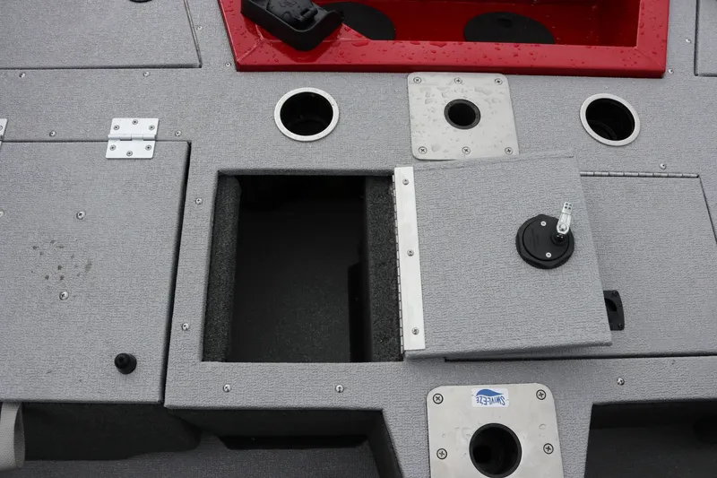 Slide: The Image of 2026 Smoker Craft Ultima 182 boat deck with storage compartments and cup holders. - 11