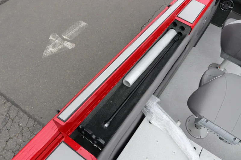 Slide: The Image of 2026 Smoker Craft Ultima 182 boat interior with red trim and seating. - 16