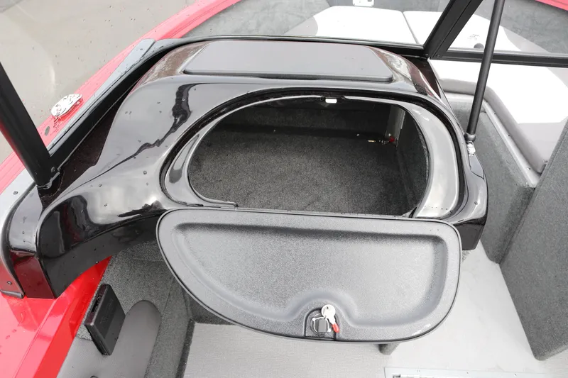 Slide: The Image of 2026 Smoker Craft Ultima 182 boat storage compartment with open lid and key. - 20