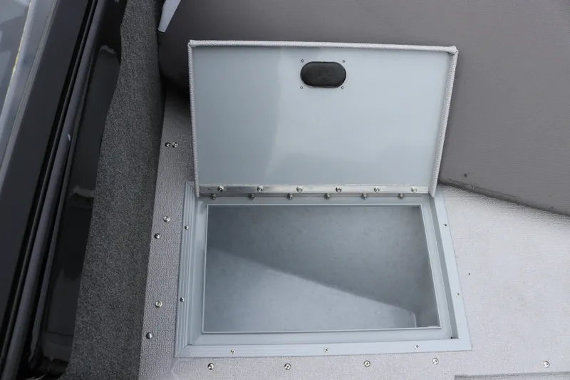 Slide: The Image of Open storage compartment on 2026 Smoker Craft Ultima 182 boat deck. - 27