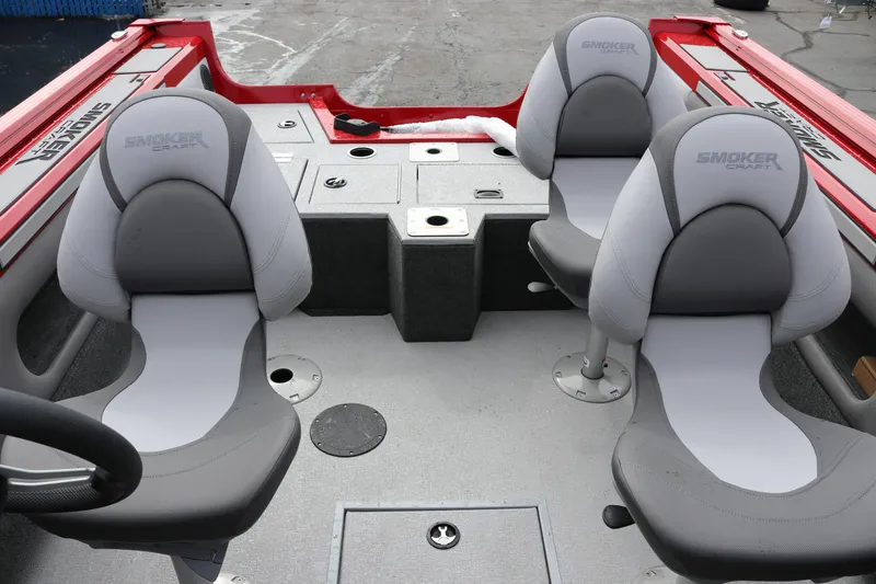 Slide: The Image of 2026 Smoker Craft Ultima 182 boat interior with gray seating and red accents. - 28