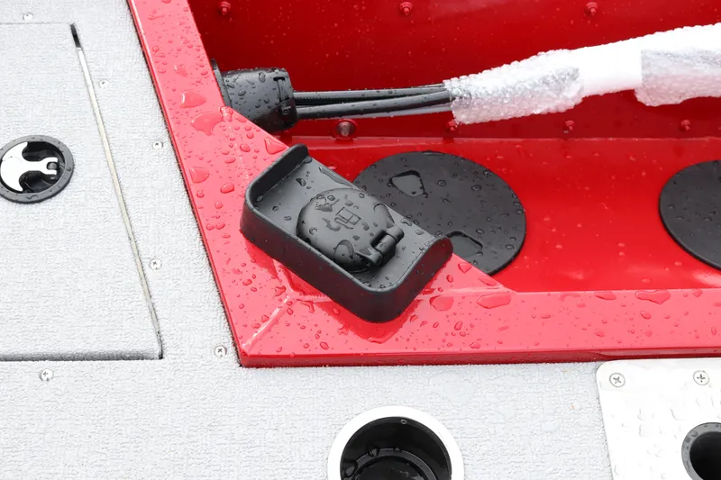 Slide: The Image of 2026 Smoker Craft Ultima 182 boat detail with water droplets on red and gray surfaces. - 30