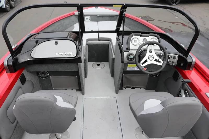 Slide: The Image of 2026 Smoker Craft Ultima 182 boat interior with steering wheel and seating. - 5