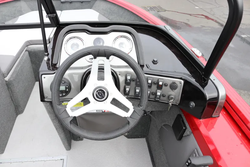 Slide: The Image of Steering console of 2026 Smoker Craft Ultima 182 boat with modern controls. - 6