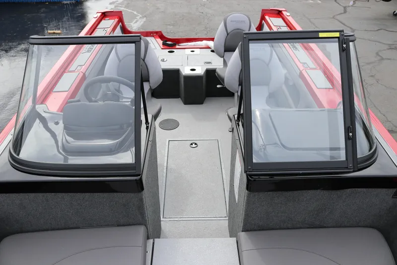 Slide: The Image of 2026 Smoker Craft Ultima 182 boat interior with dual consoles and seating. - 7