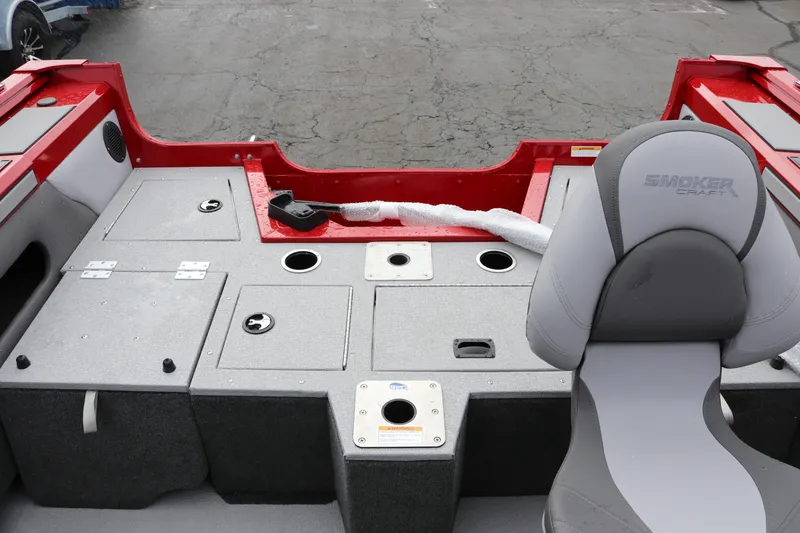 Slide: The Image of 2026 Smoker Craft Ultima 182 boat interior with seating and storage compartments. - 8