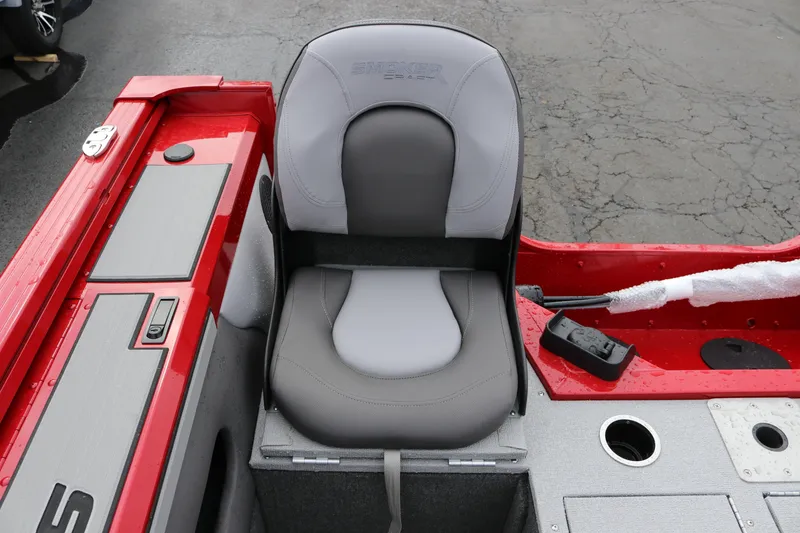 Slide: The Image of 2026 Smoker Craft Ultima 182 boat seat, gray and red design, on a textured surface. - 9