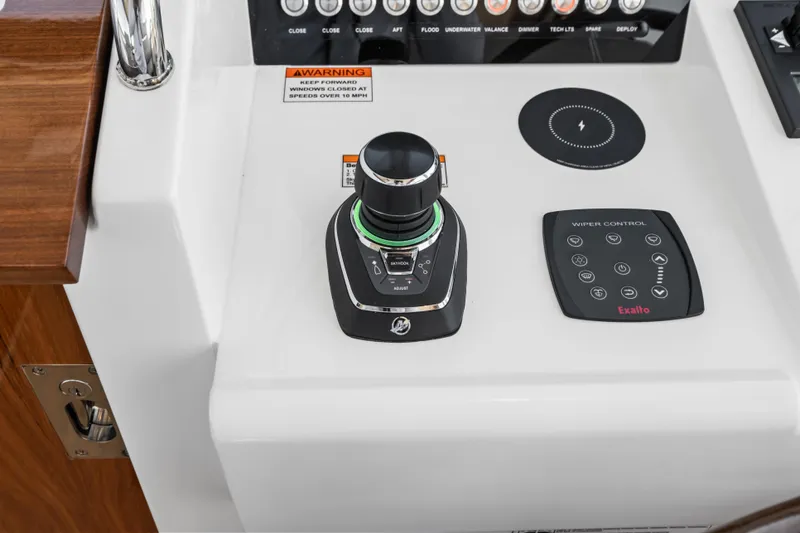 Slide: The Image of Control panel of 2026 MJM 47 R boat featuring joystick and wiper controls. - 10